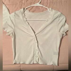 Two plain white baby tees